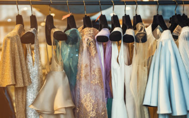 Colorful clorhes on racks in a fashion boutique