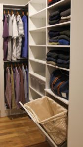 Men's wardrobe tilt-out hamper example from Closet America 