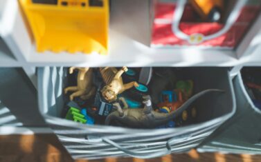 toys stored in a cube organizer
